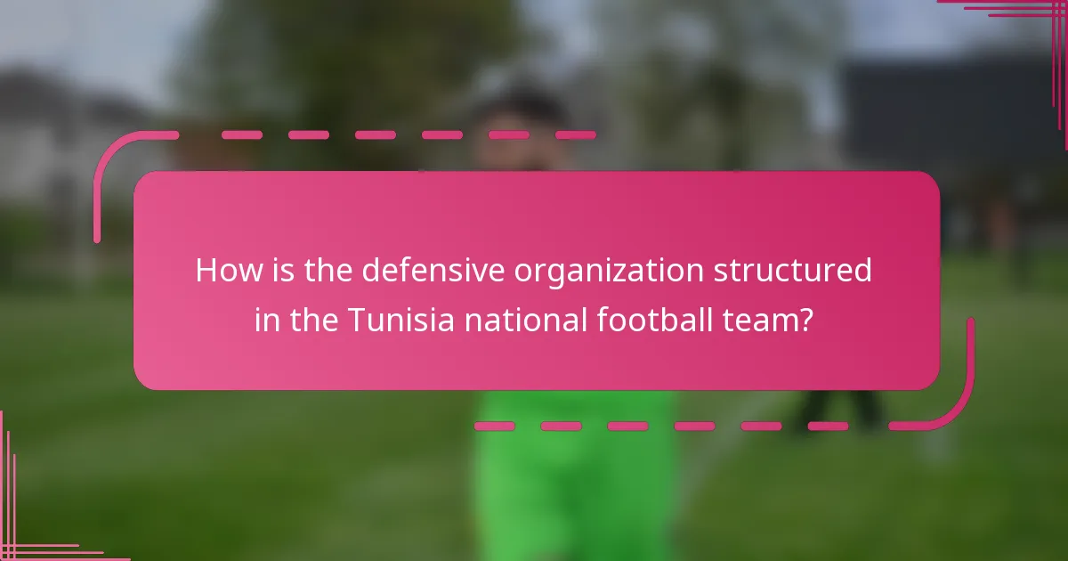 How is the defensive organization structured in the Tunisia national football team?